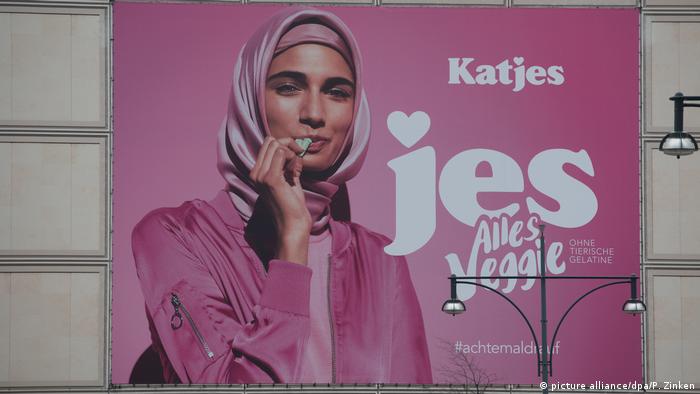 German billboard with a woman wearing a headscarf