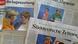 Newspapers showing German Chancellor Angela Merkel Newspapers showing German Chancellor Angela Merkel