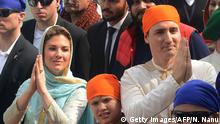 Canada Prime Minister Justin Trudeau (R) and his wife Sophie Gregoire (L) and son Xavier (C) visit the Sikh Golden Temple in Amritsar on February 21, 2018.
Trudeau and his family are on a week-long official trip to India. / AFP PHOTO / Narinder NANU (Photo credit should read NARINDER NANU/AFP/Getty Images)