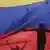 Venezuela Caracas -  Venezuela Flagge mit Schatten eines Protestierenden