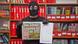A man holding the German tabloid, Bild, wearing a balaklava. A man holding the German tabloid, Bild, wearing a balaklava.