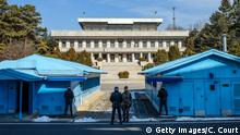 PANMUNJOM, SOUTH KOREA - FEBRUARY 07: South Korean soldiers stand guard at the border village of Panmunjom in the Demilitarized Zone (DMZ) between South and North Korea on February 7, 2018 in Panmunjom, South Korea. In a sign of thawing bilateral ties, North Korea today announced that Kim Yo-jong, the sister of North Korean leader, Kim Jong-un, will attend Friday's opening ceremony of the PyeongChang Winter Olympic Games. (Photo by Carl Court/Getty Images)