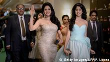 Indian Bollywood actress Sridevi Kapoor (L) arrives for the 14th International Indian Film Academy (IIFA) in Macau on July 6, 2013. The annual IIFA Awards, India's Hindi language film industry, Bollywood's glitziest awards ceremony, which have been held overseas for the last 13 years, is one of the world's most-watched annual entertainment ceremonies, broadcast to nearly 500 million viewers in 110 countries. AFP PHOTO / Philippe Lopez (Photo credit should read PHILIPPE LOPEZ/AFP/Getty Images)