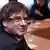 Former Catalan president Carles Puigdemont takes part in a meeting with members of the Catalan Parliament, in Brussels.