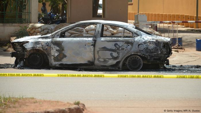 A burned car outside of the French embassy in Burkina Faso
