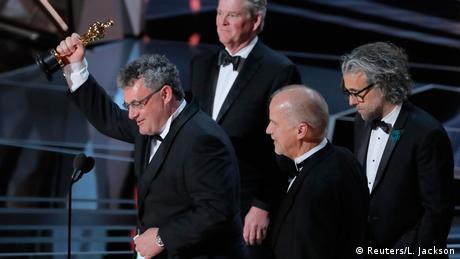 Four men receiving award for Best Visual Effects on stage (Reuters/L. Jackson)