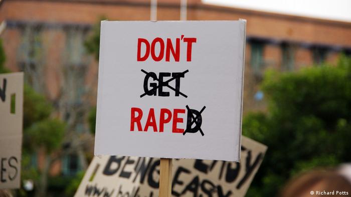 A sign reading don't get raped