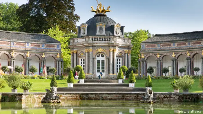 The front facade of the orangery and surrounding gardens with pond of the Hermitage in Bayreuth 