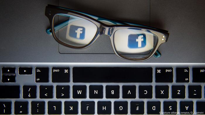 Glasses with Facebook logo reflected on lenses