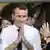 Emmanuel Macron gestures at Bikaner House in New Delhi