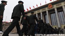 11.03.2018 *** Military delegates arrive for a vote on constitutional amendments at the National People's Congress at the Great Hall of the People in Beijing on March 11, 2018.
China's rubber-stamp parliament is set March 11 to hand President Xi Jinping free rein to rule the rising Asian superpower indefinitely, with potential abstentions offering the only suspense in the historic vote. / AFP PHOTO / GREG BAKER (Photo credit should read GREG BAKER/AFP/Getty Images)