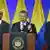 O presidente da Colômbia entre o comissário de paz Rodrigo Rivera (à esq.) e o negociador Gustavo Bell