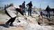 Attempted assissination attempt on Palestinian Prime Minister Rami Hamdallah in Gaza - Security forces look at crater in the road Attempted assissination attempt on Palestinian Prime Minister Rami Hamdallah in Gaza - Security forces look at crater in the road
