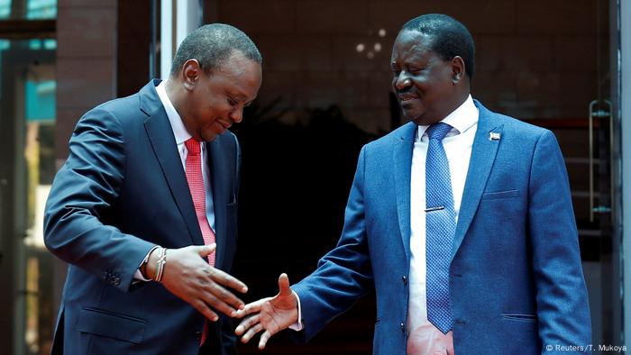 Uhuru Kenyatta and Raila Odinga shake hands (Reuters/T. Mukoya)