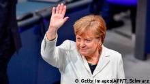 14.03.2018+++ TOPSHOT - German Chancellor Angela Merkel waves as she arrives to attends the session for the election of the German Chancellor at the Bundestag (lower house of parliament) on March 14, 2018 in Berlin. Angela Merkel, head of the Christian Democratic Party CDU starts her fourth term as German chancellor, capping months of political uncertainty as she bartered with her rivals of the SPD to help govern Europe's top economy in a grand coalition. / AFP PHOTO / Tobias SCHWARZ (Photo credit should read TOBIAS SCHWARZ/AFP/Getty Images)