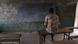 Un élève devant un tableau noir, dans une salle de classe vide (illustration) Un élève devant un tableau noir, dans une salle de classe vide (illustration)