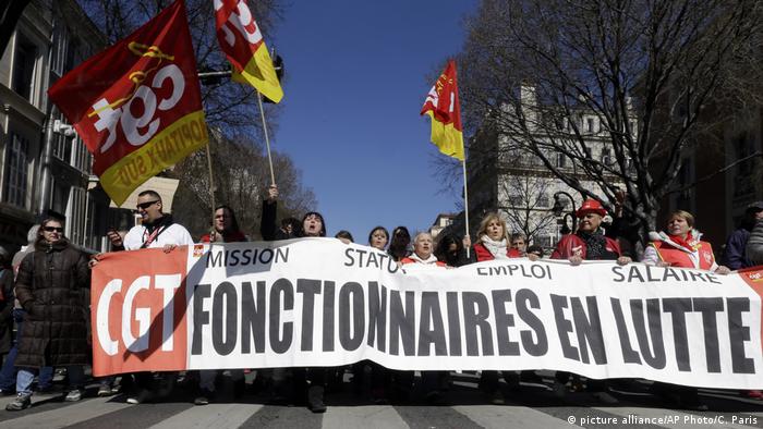 Civil servants march with a banner of the CGT union (General Work Confederation) in Marseille, on March 22