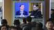Moon Jae-in and Kim Jong Un seen on a television screen at the Seoul Railway Station Moon Jae-in and Kim Jong Un seen on a television screen at the Seoul Railway Station
