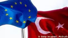 ISTANBUL, TURKEY - NOVEMBER 24: An EU and Turkish National flag are seen outside a shopping mall on November 24, 2016 in Istanbul, Turkey. European Parliament today voted to suspend Turkey's EU membership talks. Turkey's President Recep Tayyip Erdogan said the decision has no value for us. The Turkish Lira has weakened significantly since the July 15th failed coup attempt forcing Turkey's central bank today to raise interest rates for the first time in nearly three years. (Photo by Chris McGrath/Getty Images)