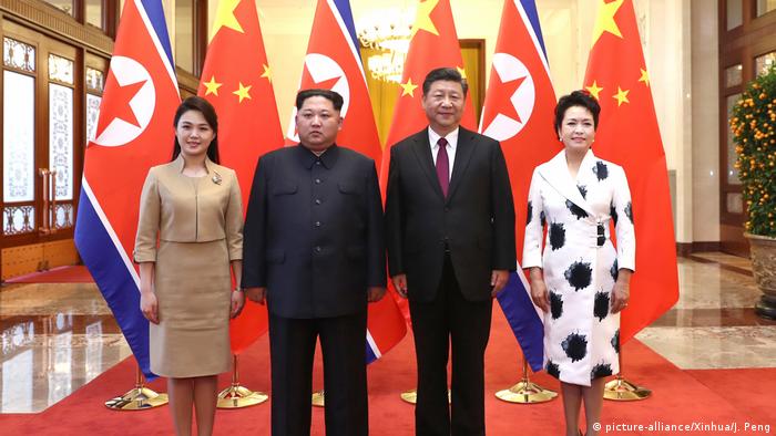 Xi Jinping (2nd R), Chinese president, and his wife Peng Liyuan (1st R) with Kim Jong Un (2nd L) and his wife Ri Sol Ju