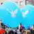 Peace doves on two blue balloons