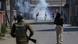 Kashmiri protesters engulfed in tear gas smoke clash with Indian paramilitary soldiers during a protest against the killing of rebels in Srinagar, Indian controlled Kashmir, Sunday, April 1, 2018 Kashmiri protesters engulfed in tear gas smoke clash with Indian paramilitary soldiers during a protest against the killing of rebels in Srinagar, Indian controlled Kashmir, Sunday, April 1, 2018