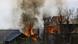 Houses on fire during gun batte in Indian Kashmir Houses on fire during gun batte in Indian Kashmir