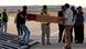 Coffin of one of the workers being loaded onto the plane Coffin of one of the workers being loaded onto the plane