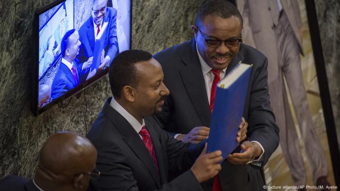 Prime Minister Abiy Ahmed holds the Ethiopian constitution