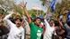 Dalit community protesters raise their hands and wave flags Dalit community protesters raise their hands and wave flags