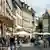 People stroll along the old market square in Ilmenau