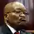 Former South African President Jacob Zuma looks away from the camera and pouts