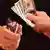 graphic of hands holding a woman and cash
