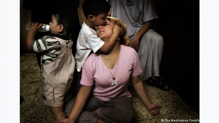 A woman with her two children. Andrea Bruce Iraq, Baghdad 2003