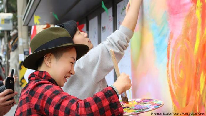 Two artists painting (Yemeni Student Union/World Culture Open)