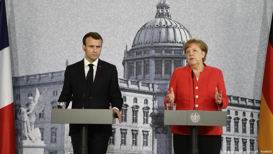 Merkel and Macron present united front in Berlin