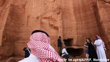 A picture taken on March 31, 2018 shows a Saudi man standing at the entrance of a tomb at Madain Saleh, a UNESCO World Heritage site, near Saudi Arabia's northwestern town of al-Ula.
Al-Ula, an area rich in archaeological remnants, is seen as a jewel in the crown of future Saudi attractions as the austere kingdom prepares to issue tourist visas for the first time -- opening up one of the last frontiers of global tourism. Saudi Crown Prince Mohammed bin Salman is set to sign a landmark agreement with Paris on April 10, 2018 for the touristic and cultural development of the northwestern site, once a crossroads of ancient civilisations. / AFP PHOTO / FAYEZ NURELDINE (Photo credit should read FAYEZ NURELDINE/AFP/Getty Images)
