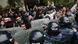 Police stand with shields in front of protesters in Armenia Police stand with shields in front of protesters in Armenia