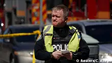 A pedestrian officer responds to an incident where a van struck multiple people in Toronto. (Reuters/C. Allegri)