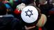 A man wears a kippa to denounce an anti-Semitic attack on a young man wearing a kippa in Berlin in April 2018 A man wears a kippa to denounce an anti-Semitic attack on a young man wearing a kippa in Berlin in April 2018
