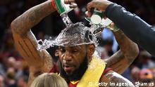 CLEVELAND, OH - APRIL 25: LeBron James #23 of the Cleveland Cavaliers is showered with water while being interviewed after a 98-95 win over the Indiana Pacers in Game Five of the Eastern Conference Quarterfinals during the 2018 NBA Playoffs at Quicken Loans Arena on April 25, 2018 in Cleveland, Ohio. NOTE TO USER: User expressly acknowledges and agrees that, by downloading and or using this photograph, User is consenting to the terms and conditions of the Getty Images License Agreement. (Photo by Gregory Shamus/Getty Images)