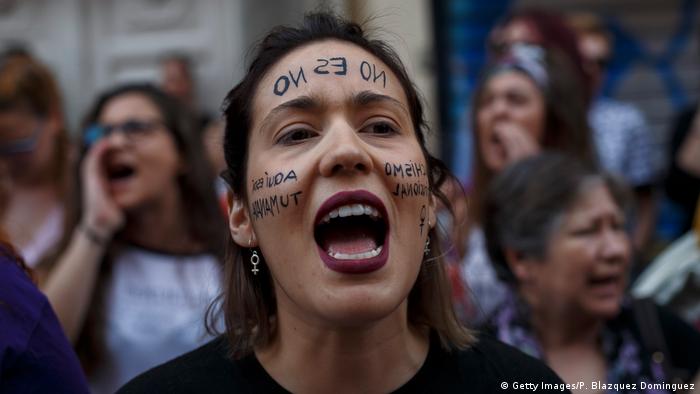 Woman with 'No is no' written on forehead protesting in Madrd