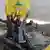 Supporters of Lebanon's Hezbollah leader Sayyed Hassan Nasrallah hold Hezbollah flags