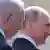 Netanyahu stands beside Vladimir Putin