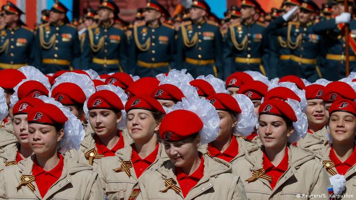 Members of Russia's Yunarmiya line up in uniforms and red berets for the Victory Day parade