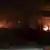 Buildings in Syria burn after Israeli strikes