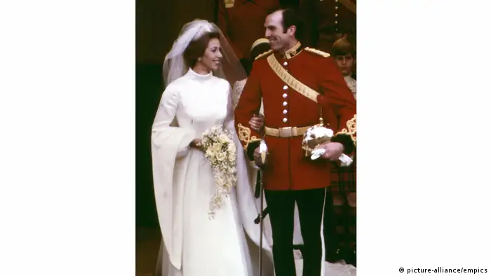 For her wedding to Captain Mark Phillips in 1973, Queen Elizabeth's daughter Princess Anne chose a Tudor-style gown with medieval sleeves designed by Maureen Baker. The dress was noted at the time for adhering to contemporary fashion trends in a break from more traditional styles for royal brides. Anne was also the first English princess to be heavily involved in the design process herself.