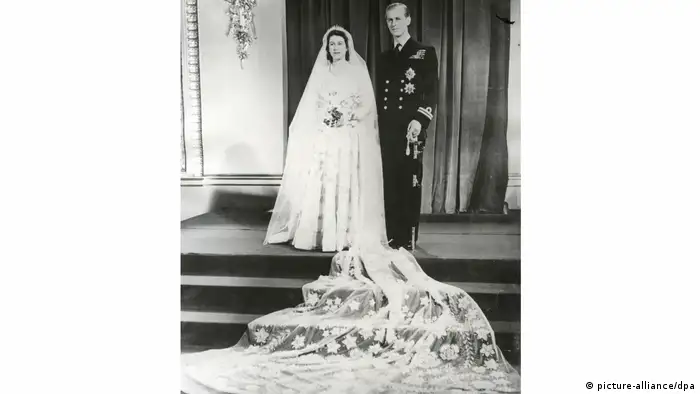 When then-Princess Elizabeth married Prince Philip in 1947, wartime rationing was still in effect. Elizabeth used ration coupons, some donated from young women across the country, to purchase the silk for her Norman Hartnell gown. The dress was adorned with crystals and more than 10,000 seed pearls imported from the US. The train was 13 feet (4 m) long.