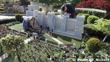 A LEGO Windsor Castle replete with the upcoming wedding between Britain's Prince Harry and Meghan Markle, is worked on by staff at Legoland, in Windsor, Britain May 10, 2018. REUTERS/Peter Nicholls