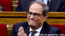 Junts per Catalonia (Together for Catalonia) MP and presidential candidate Quim Torra gestures during a vote session to elect a new regional president at the Catalan parliament in Barcelona on May 14, 2018. - The Catalan parliament is expected to elect fiercely pro-independence candidate Quim Torra to be its regional president today as separatists seek to end the emergency direct rule imposed by Madrid last year and renew their secession bid. (Photo by LLUIS GENE / AFP) (Photo credit should read LLUIS GENE/AFP/Getty Images)